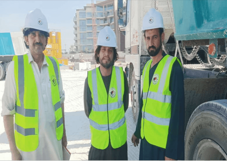 Paktia Star crew in hard hats and safety vests on a Dubai construction site